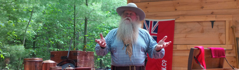 Historic Reenactor Dennis Johnson in front of Northwest Company Store